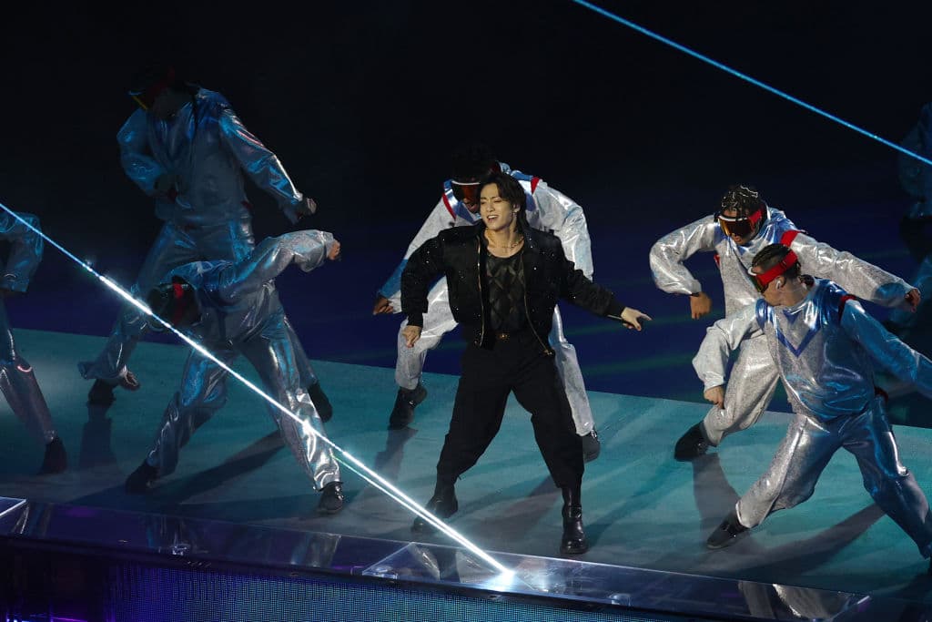 AL KHOR, QATAR - NOVEMBER 20: Jung Kook of BTS performs during the opening ceremony prior to the FIFA World Cup Qatar 2022 Group A match between Qatar and Ecuador at Al Bayt Stadium on November 20, 2022 in Al Khor, Qatar. (Photo by Elsa/Getty Images)