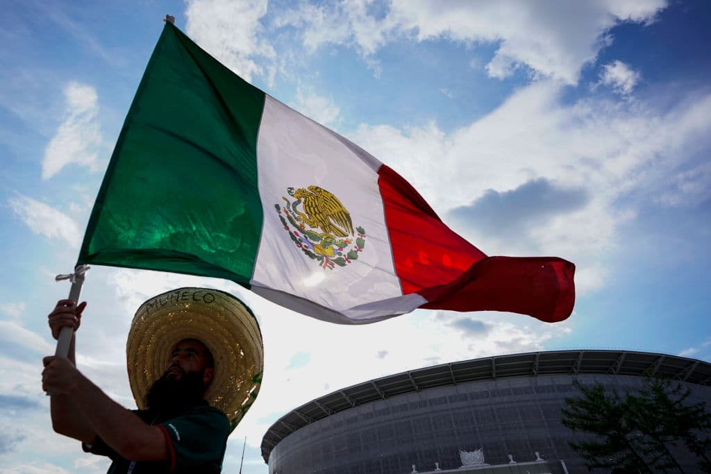 YEKATERINBURG, RUSSIA - JUNE 27: A fan of Mexico waves a flag prior to the 2018 FIFA World Cup Russia group F match between Mexico and Sweden at Ekaterinburg Arena on June 27, 2018 in Yekaterinburg, Russia. (Photo by Carlos Cuin/Jam Media/Getty Images)