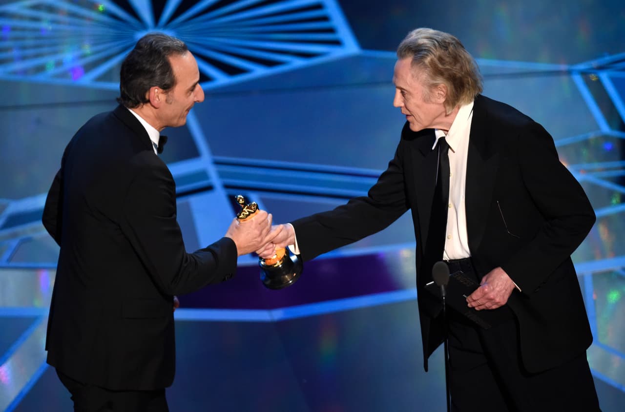 Christopher Walken, right, presents Alexandre Desplat with the award for best original score for "The Shape of Water" at the Oscars on Sunday, March 4, 2018, at the Dolby Theatre in Los Angeles. (Photo by Chris Pizzello/Invision/AP)