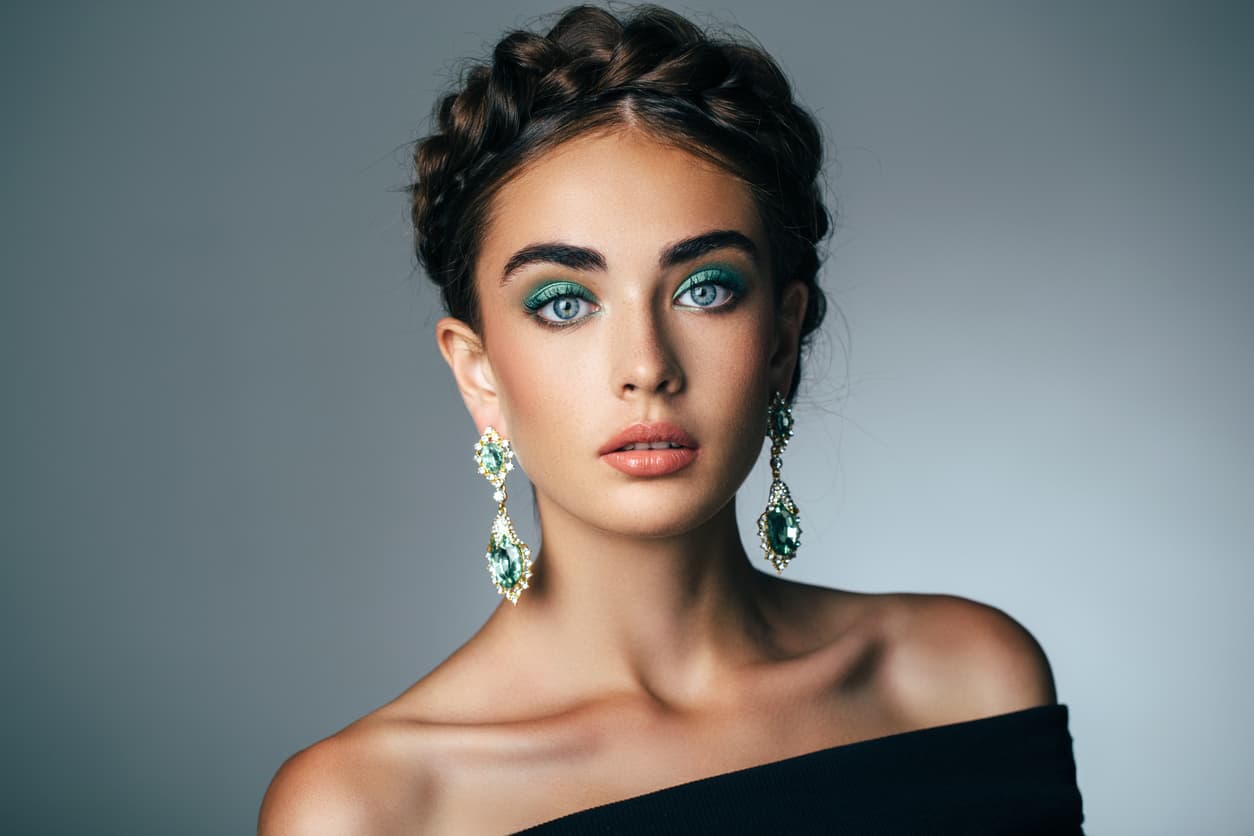 Studio shot of young beautiful woman. Professional make-up and hair style.