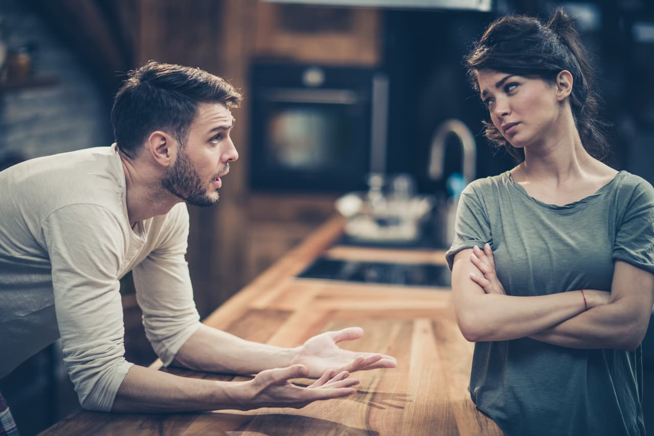 Young couple arguing about their problems at home.