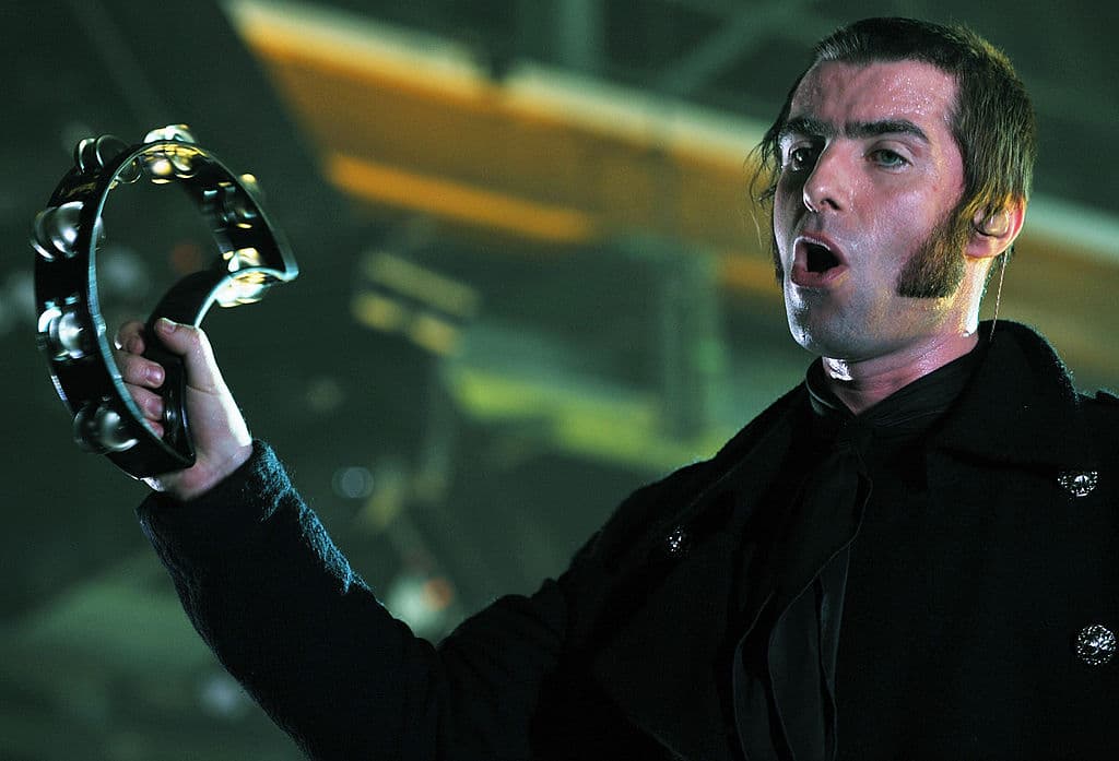 Liam Gallagher of the band Oasis performs on stage in the southern German city of Munich on February 27, 2009. Oasis are touring around Europe to promote their new "Dig out your soul" album. AFP PHOTO DDP / JOERG KOCH GERMANY OUT (Photo credit should read JOERG KOCH/DDP/AFP via Getty Images)