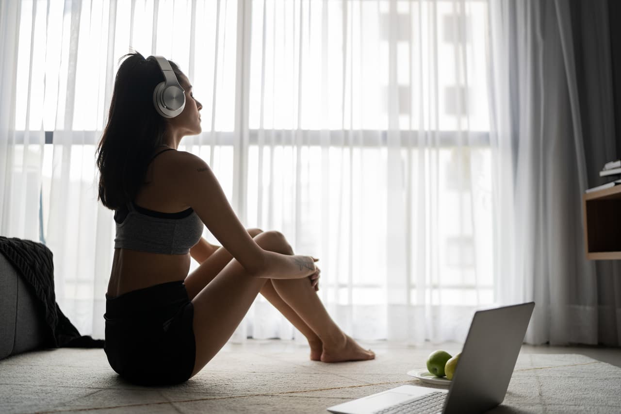 Young woman relaxing listening to music at home