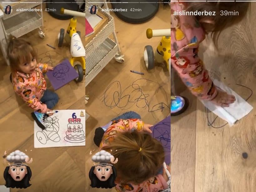 Kailani le muestra a su mamá la obra de arte que dibujó en el suelo y algunos de sus juguetes.