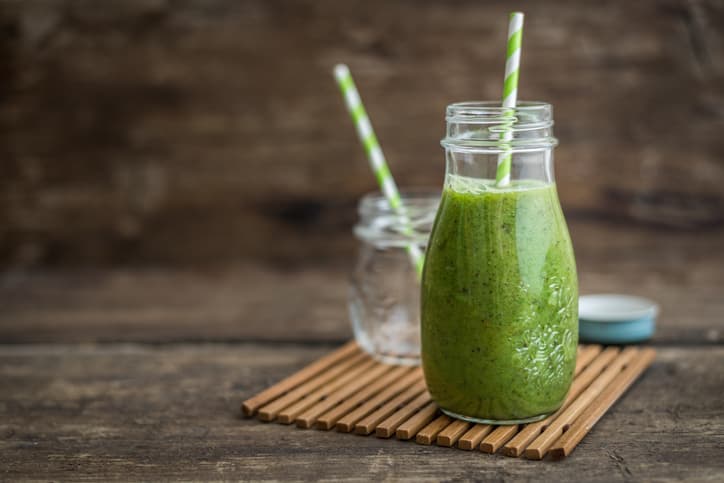 Fresh Green Smoothie on Rustic Wood