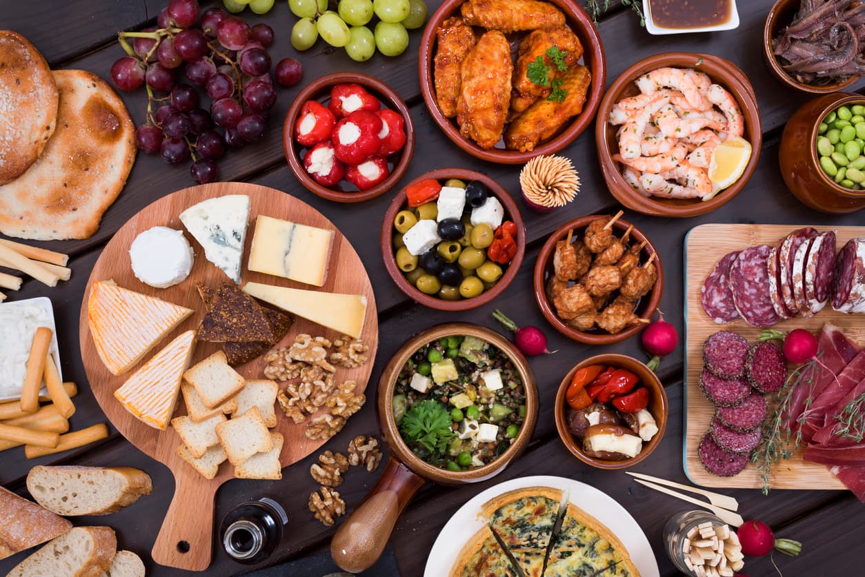 Top view of different tapas food recipes. Delicious table of foods.