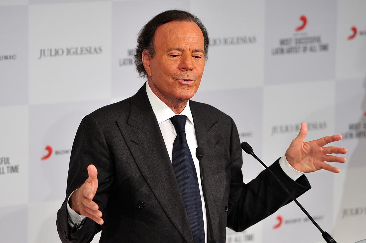 Spanish singer Julio Iglesias speaks during a press conference after being named the most successful Latin artist of all time at an event in London on May 12, 2014. AFP PHOTO / CARL COURT (Photo credit should read CARL COURT/AFP/Getty Images)