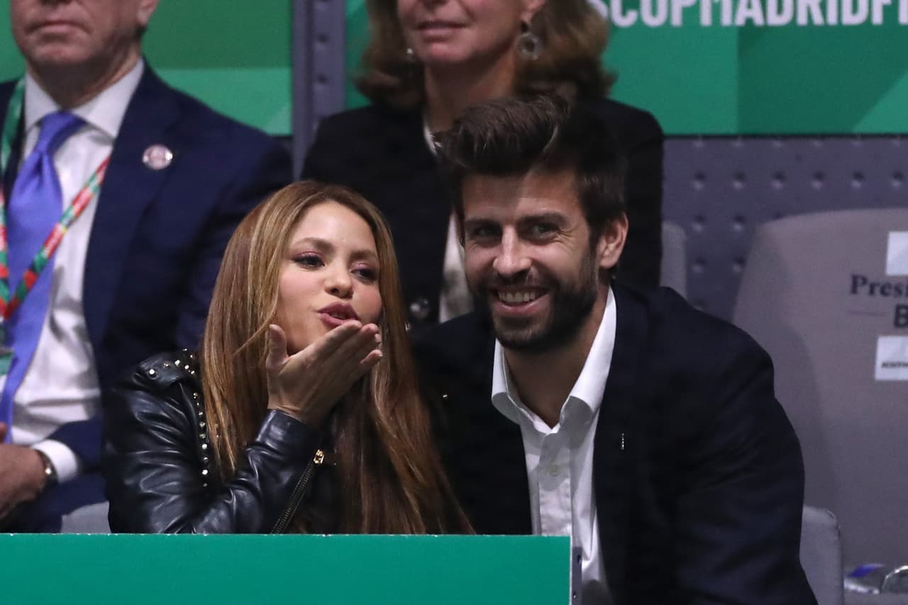 MADRID, SPAIN - NOVEMBER 24: Singer Shakira (L) and her husband and footballer Gerard Pique of FC Barcelona (R) react in the stands as they watch the singles final match between Rafael Nadal of Spain and Denis Shapovalov of Canada during Day Seven of the 2019 Davis Cup at La Caja Magica on November 24, 2019 in Madrid, Spain. (Photo by Alex Pantling/Getty Images)